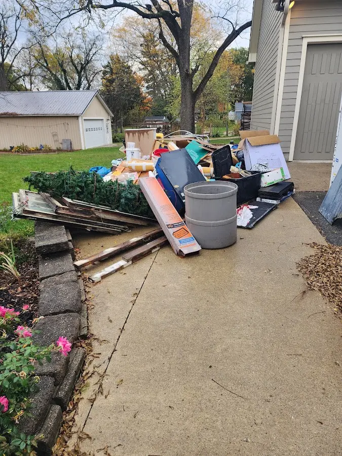 Dumpster being loaded with debris for Commercial Dumpster Rental in Wewoka